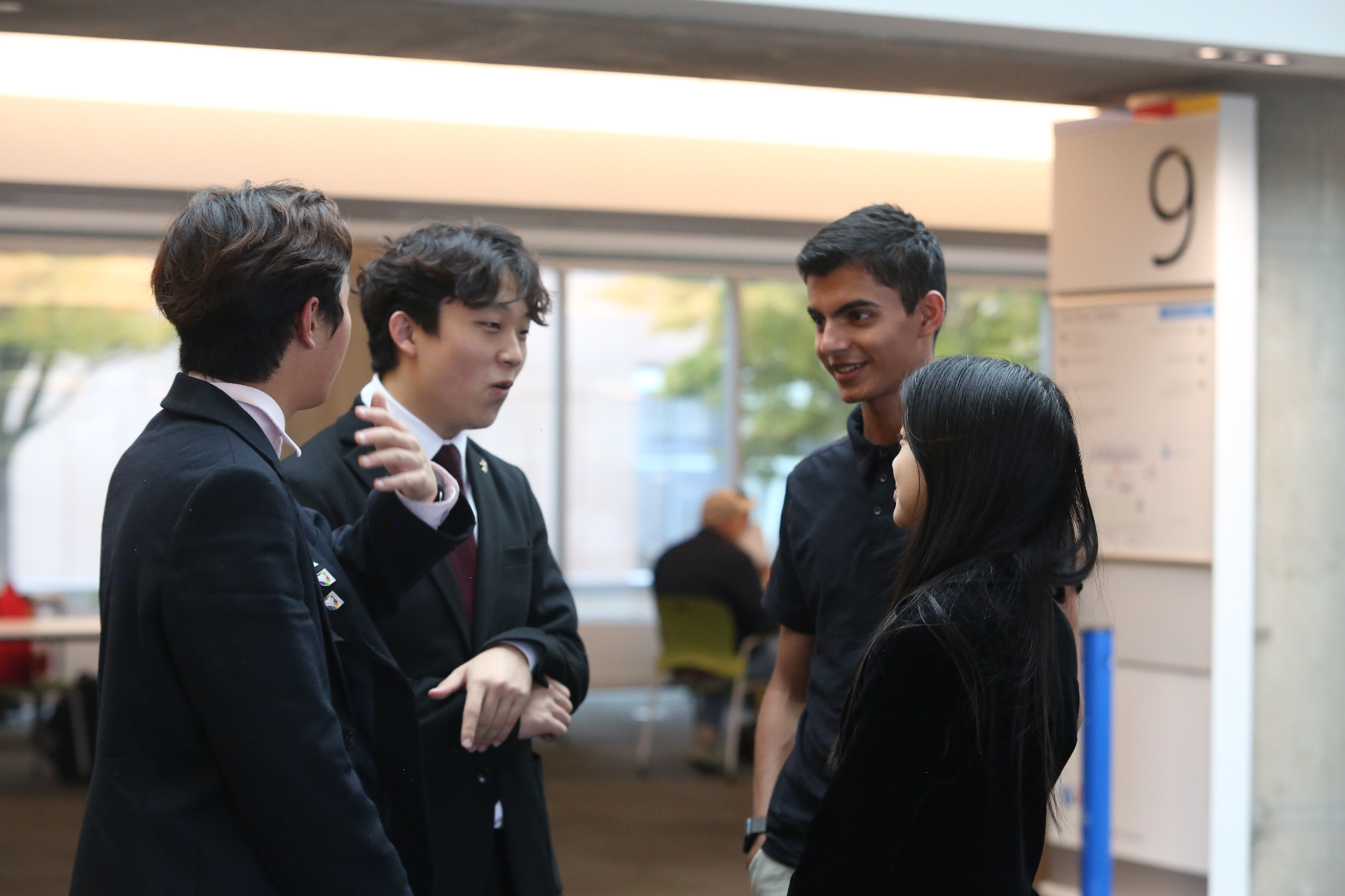 Talking with attendees in the hallway