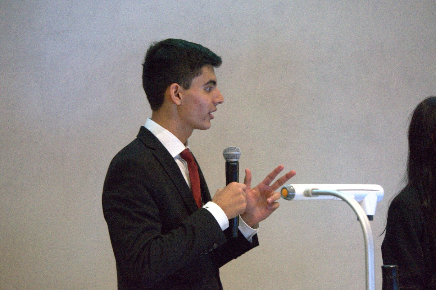 Speaking to the room at the R.E.A.L. event